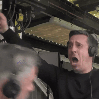 A Man Wearing Headphones Is Screaming With His Mouth Wide Open GIF