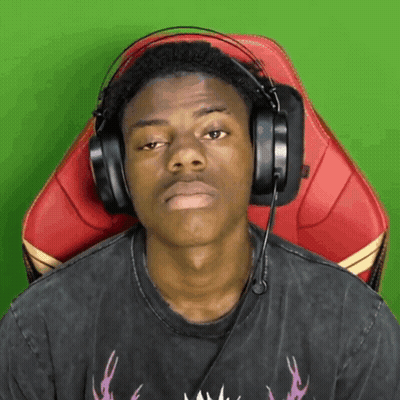 A Man Wearing Headphones Is Sitting In A Chair With A Green Background GIF