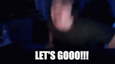 A Man Wearing Headphones Is Sitting In Front Of A Computer Screen With The Words `` Let 'S Goooo ! '' GIF