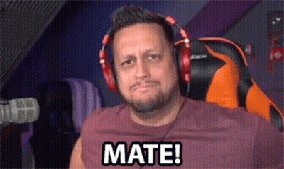 A Man Wearing Headphones Is Sitting In Front Of A Microphone And Saying Mate ! GIF