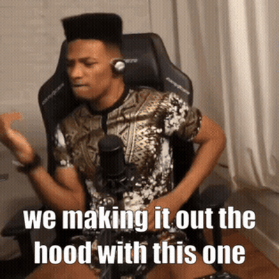 A Man Wearing Headphones Is Sitting In Front Of A Microphone With The Caption We Making It Out The Hood With This One . GIF