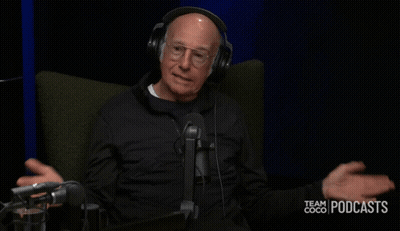 A Man Wearing Headphones Is Sitting In Front Of A Microphone With The Words Did Not Go Over Well Behind Him GIF