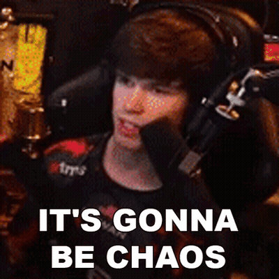 A Man Wearing Headphones Is Sitting In Front Of A Microphone With The Words It 'S Gonna Be Chaos Below Him GIF