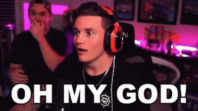 A Man Wearing Headphones Is Sitting In Front Of A Microphone With The Words `` Oh My God '' . GIF