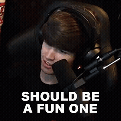 A Man Wearing Headphones Is Sitting In Front Of A Microphone With The Words Should Be A Fun One Below Him . GIF