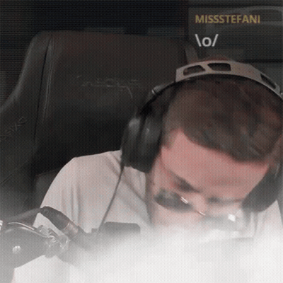 A Man Wearing Headphones Is Sitting In Front Of A Screen That Says Missstefani GIF