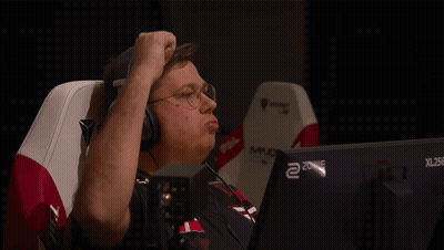A Man Wearing Headphones Is Sitting In Front Of A Xl 256 Monitor GIF