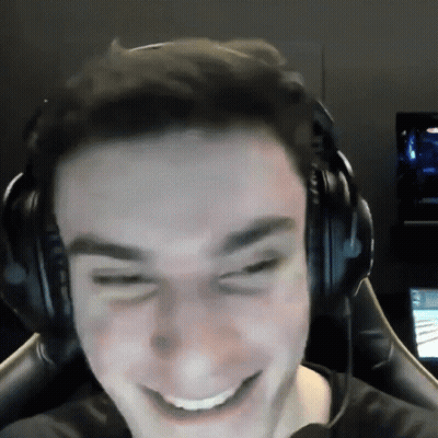 A Man Wearing Headphones Is Smiling And Making A Face GIF
