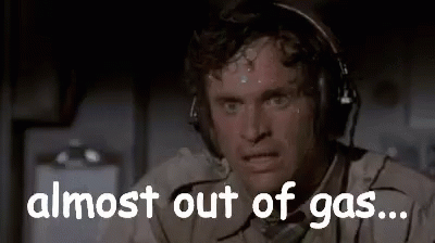 A Man Wearing Headphones Is Sweating And Saying `` Almost Out Of Gas ... '' GIF