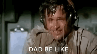 A Man Wearing Headphones Is Sweating And Saying `` Dad Be Like '' While Sitting On A Plane . GIF