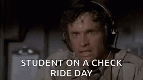 A Man Wearing Headphones Is Sweating While Sitting On A Plane And Says `` Student On A Check Ride Day '' . GIF