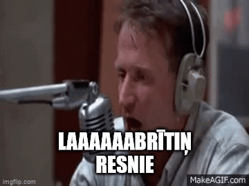 A Man Wearing Headphones Is Talking Into A Microphone And Holding A Gun . GIF