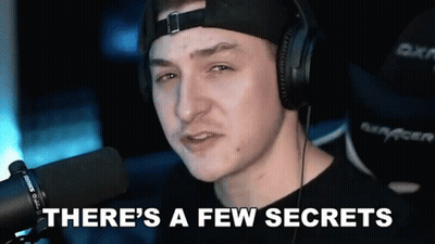 A Man Wearing Headphones Is Talking Into A Microphone And Saying There 'S A Few Secrets . GIF