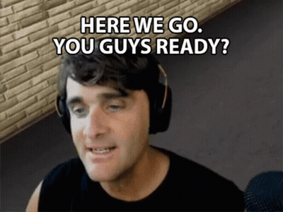 A Man Wearing Headphones Is Talking Into A Microphone And Says `` Here We Go , You Guys Ready '' . GIF