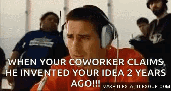 A Man Wearing Headphones Is Talking Into A Microphone . GIF