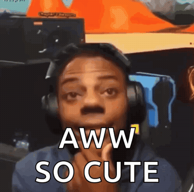 A Man Wearing Headphones Says Aww So Cute . GIF