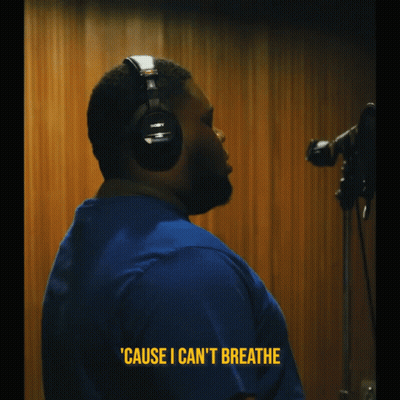 A Man Wearing Headphones Says ' Cause I Can 'T Breathe ' In Yellow Letters GIF