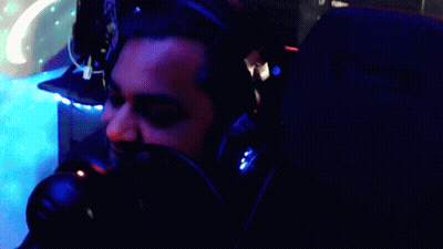 A Man Wearing Headphones Says " Here Comes The Party Pooper " GIF