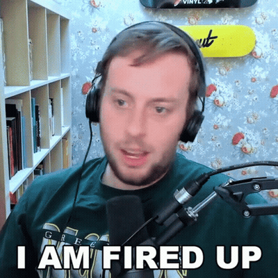 A Man Wearing Headphones Says " I Am Fired Up " GIF