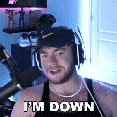 A Man Wearing Headphones Says I 'M Down In Front Of A Microphone . GIF
