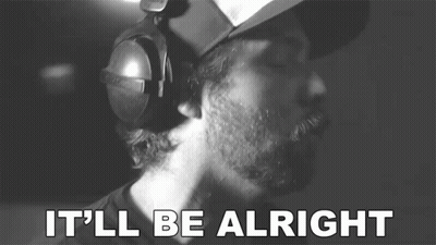 A Man Wearing Headphones Says It 'Ll Be Alright In A Black And White Photo GIF