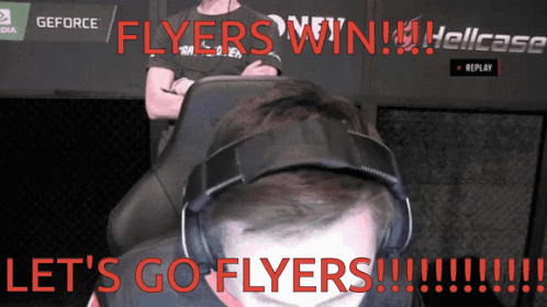 A Man Wearing Headphones Says Let 'S Go Flyers In Red GIF