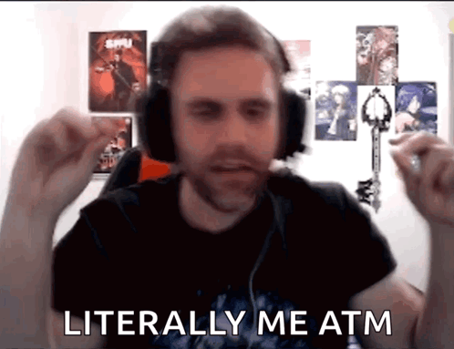 A Man Wearing Headphones Says Literally Me Atm While Holding A Key GIF