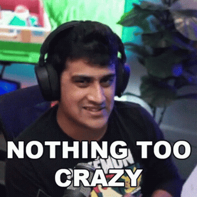 A Man Wearing Headphones Says " Nothing Too Crazy " In Front Of A Green Screen GIF