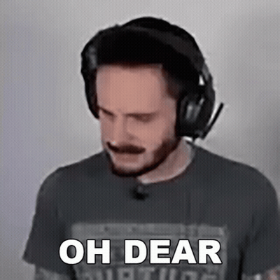 A Man Wearing Headphones Says " Oh Dear " In Front Of His Face GIF