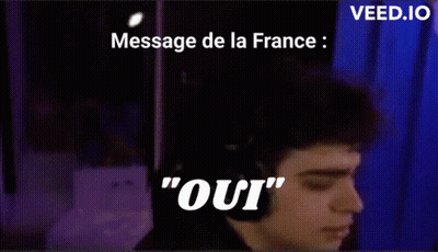 A Man Wearing Headphones Says " Oui " In Front Of A Purple Background GIF