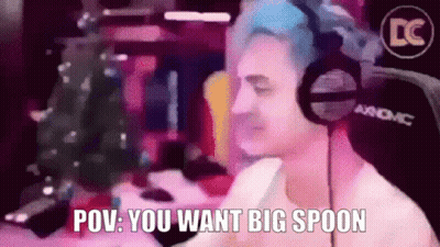 A Man Wearing Headphones Says " Pov You Want Big Spoon " In Front Of A Christmas Tree GIF