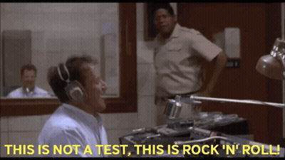 A Man Wearing Headphones Says " This Is Not A Test This Is Rock ' N ' Roll " GIF