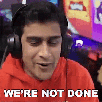 A Man Wearing Headphones Says " We 'Re Not Done " In Front Of A Computer Screen GIF