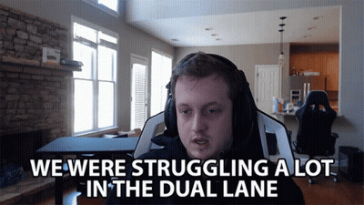 A Man Wearing Headphones Says We Were Struggling In The Dual Lane GIF