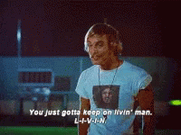 A Man Wearing Headphones Says You Just Gotta Keep On Livin ' Man L-I-V-I-N GIF