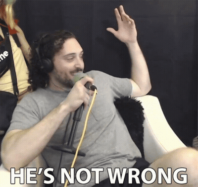 A Man Wearing Headphones Singing Into A Microphone With The Words He 'S Not Wrong Below Him GIF