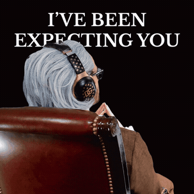 A Man Wearing Headphones Sits In A Chair With The Words I 'Ve Been Expecting You GIF