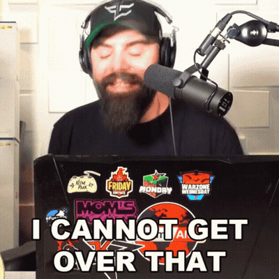 A Man Wearing Headphones Stands In Front Of A Laptop That Says I Cannot Get Over That On It GIF