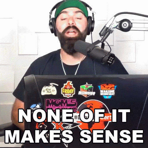 A Man Wearing Headphones Stands In Front Of A Microphone With The Words None Of It Makes Sense Below Him GIF