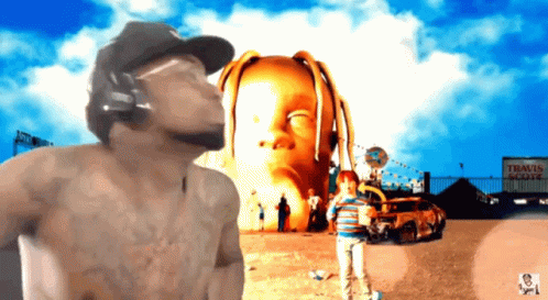 A Man Wearing Headphones Stands In Front Of A Sign That Says " Travis Scott " On It GIF