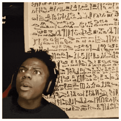 A Man Wearing Headphones Stands In Front Of A Wall With Ancient Writing GIF