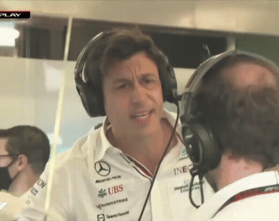 A Man Wearing Headphones Talks To Another Man Who Is Wearing A Shirt That Says Ubs GIF