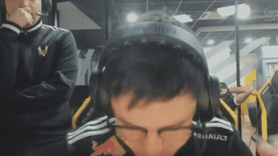 A Man Wearing Headphones That Say Renault On Them GIF