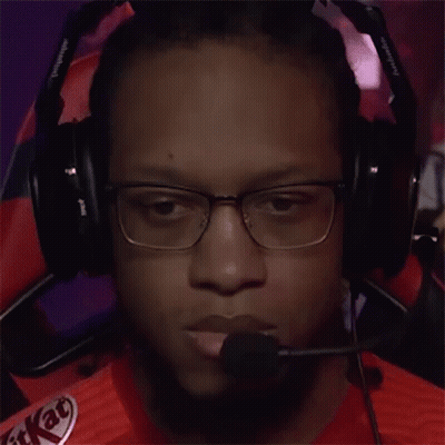 A Man Wearing Headphones With A Kitkat Logo On His Shirt GIF