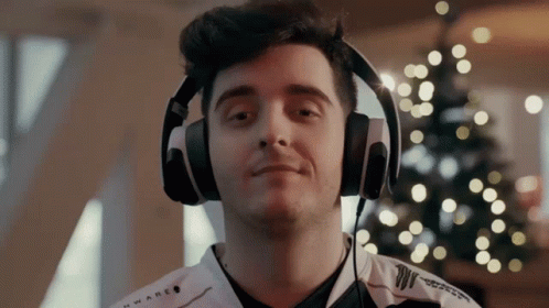 A Man Wearing Headphones With The Word Alien On The Front GIF