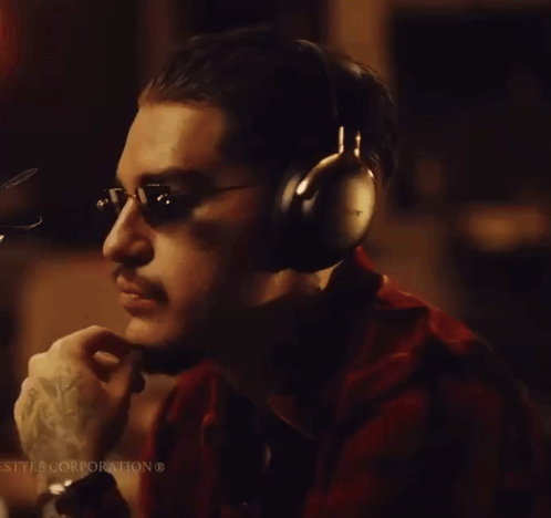 A Man Wearing Headphones With The Word Sony Written On It GIF