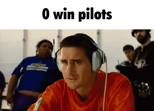 A Man Wearing Headphones With The Words 0 Win Pilots Written Above Him GIF