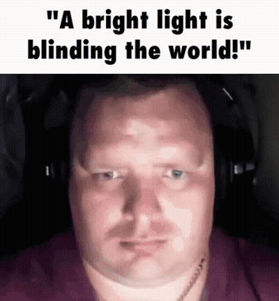 A Man Wearing Headphones With The Words " A Bright Light Is Blinding The World " On The Bottom GIF