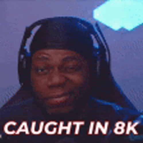 A Man Wearing Headphones With The Words `` Caught In 8K '' Written On It . GIF