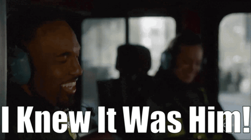 A Man Wearing Headphones With The Words I Knew It Was Him Behind Him GIF